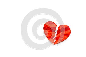 Red paper broken heart on white background