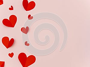 Red paper heart valentine day card on pink background with copy space for text