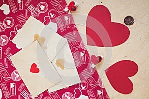 Red paper hearts with pins and envelopes