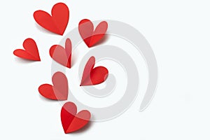 Red paper hearts on white background concept of Valentine's day