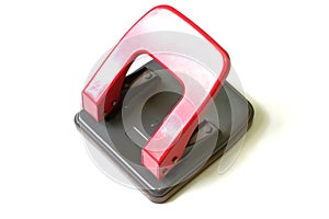 Red paper hole puncher on a white background