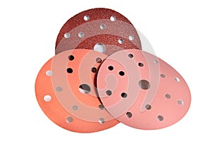 Red paper sanding disc for quick release holder for angle grinder isolated on white background