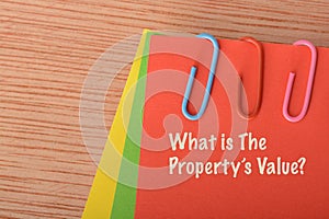 Red paper written with WHAT IS THE PROPERTY\'S VALUE