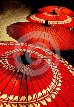 Red parasols in a row