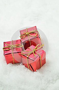 Red Parcels on Snow Background