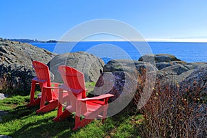 Red Parks Canada Adirondack Chairs at Fort Rodd Hill National Historic Park, Vancouver Island, British Columbia, Canada