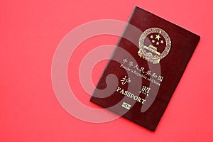 Red passport of People Republic of China. PRC chinese passport on bright background