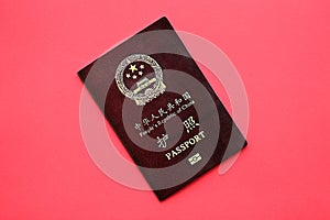 Red passport of People Republic of China. PRC chinese passport on bright background