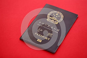 Red passport of People Republic of China. PRC chinese passport on bright background