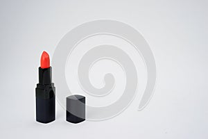 Red pastel lipstick on isolated white background with copy space