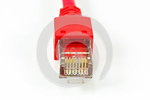 Red patch cable with RJ45 connector isolated on white background