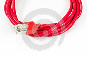 Red patch cable with RJ45 connector isolated on white background