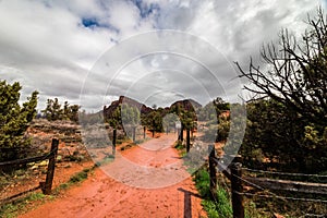 Red pathway leading to the rolling red hills outside Sedona, AZ, USA