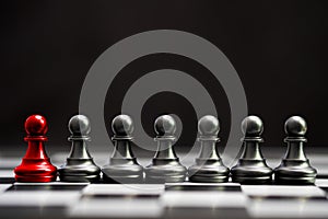 Red pawn chess with others black pawn chess for leader and different thinking.Disrupt concept.