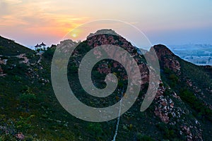 The Red peaks of Chifeng city sunset landscape