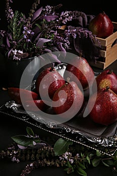 Red pears Red Bartlett sort in a low key on the black background.