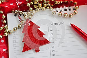 Red Pen Point to Blank Wish List Decorated with Christmas Tree paper cut