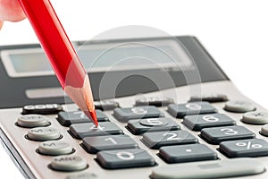 Red pencil and calculator