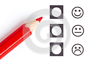 Red pencil choosing the right smiley