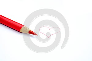 Red pencil crayon and a heart