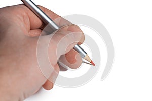 Red pencil in male left hand on blank paper white background. Left hand day concept. Copy space