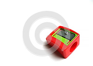 Red pencil sharpener with a green element