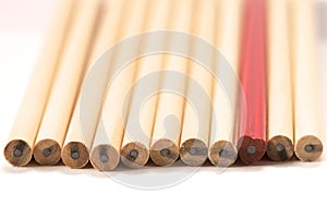 Red pencil among wooden