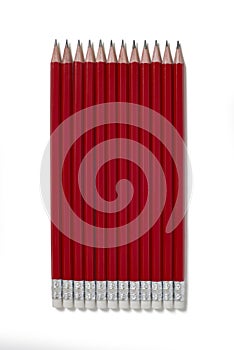 Red pencils with eraser on white background