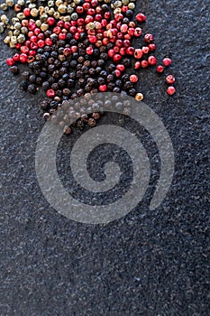 red pepper on black stone, gourmet spices and background for traditional Ionian or spicy cuisine. Background for kitchen and for
