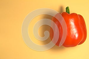 Red pepper. Colored background. Close-up. Upper foreshortening