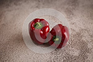 Red pepper lies on a white background