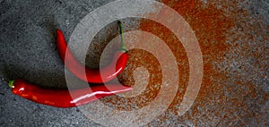 Red pepper and paprika powder on a table flat lay