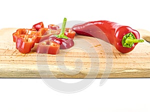 Red pepper sliced on a wooden cutting board