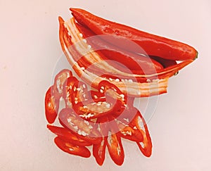 Red pepper slides on white background