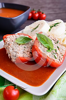Red pepper stuffed with rice, minced meat and vegetable in tomato sauce with steamed dumpling
