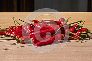 Red pepper on table, very popular ingredient that makes the kitchen delights very tasty.