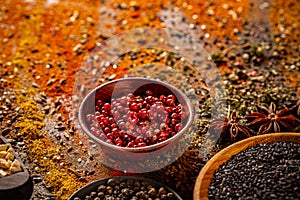 Red peppercorn in wooden bowl
