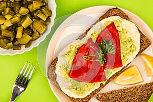 Red Peppers With Avocado and Hummus On Rye Open Face Sandwich