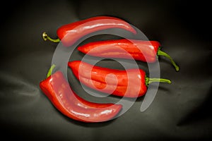 Red peppers on a black background