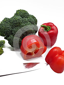 Red peppers and broccoli released on white background