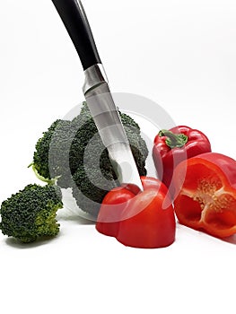 Red peppers and broccoli released on white background