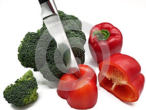 Red peppers and broccoli released on white background