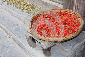 Red peppers are drying outdoor, ingredients for Chinese cuisine, China