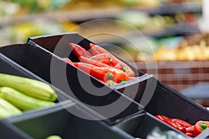 Red peppers on the shelves of a grocery supermarket. Sale of vegetables