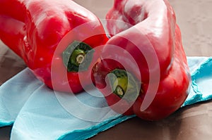 Red peppers, on table with brown tablecloth