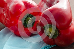 Red peppers, on table with brown tablecloth