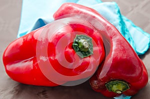 Red peppers, on table with brown tablecloth