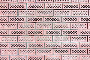 Red perforated bricks wall background