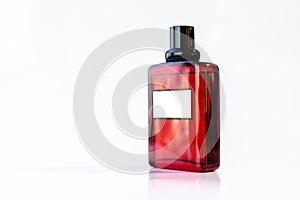 Red perfume glass bottle on white bakground or  isolated