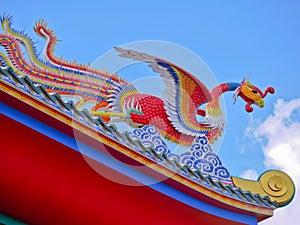Red phoenix bird in Chinese temple with close up view